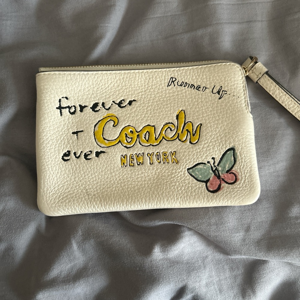 Coach Cream Wristlet with Text and Butterfly Design